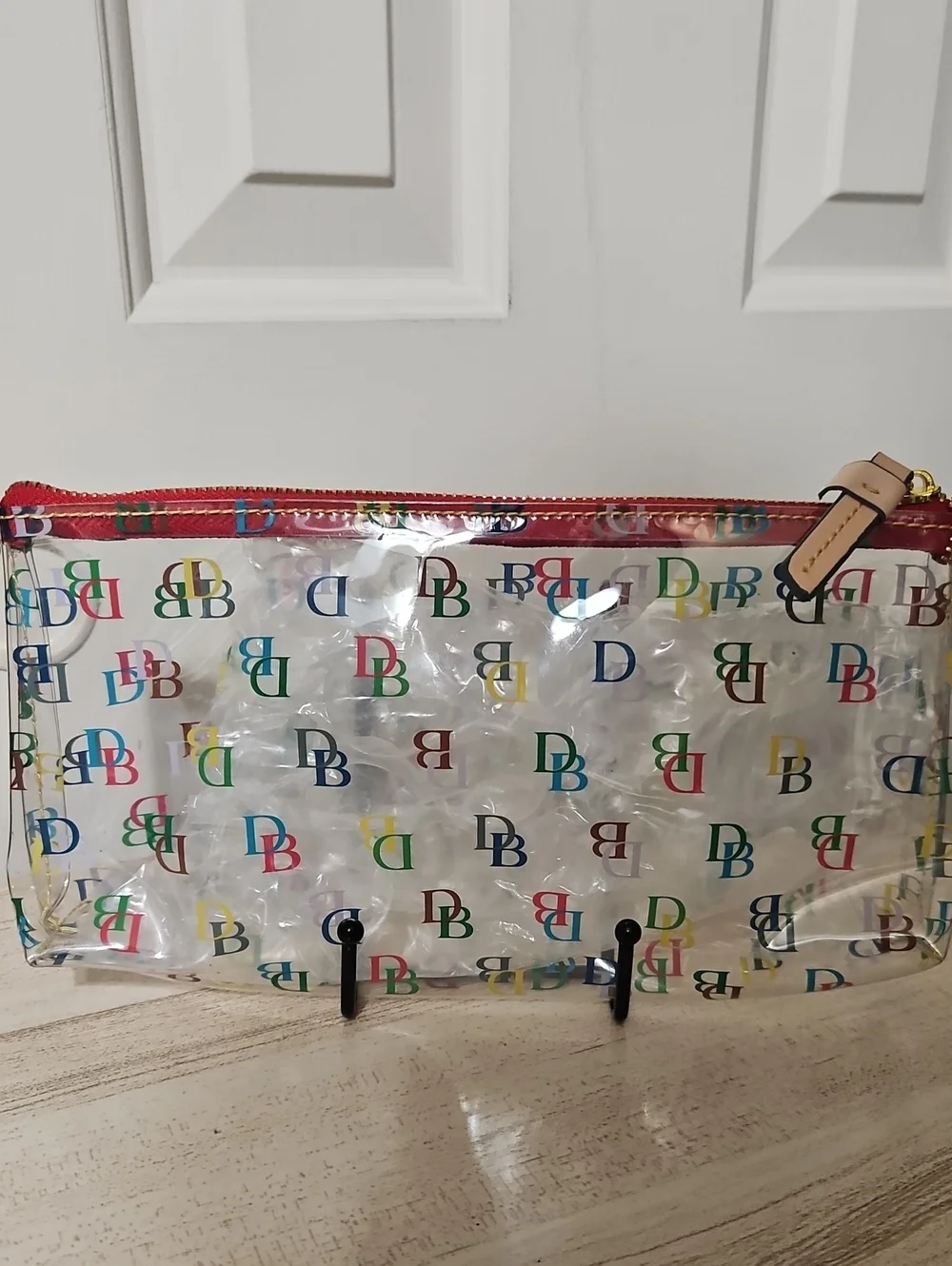 Dooney & Bourke NWOT Clear PVC Cosmetic Pouch with Multicolor DB Logo